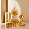24K Gold Handwash bottle on a gold platform with decorative elements